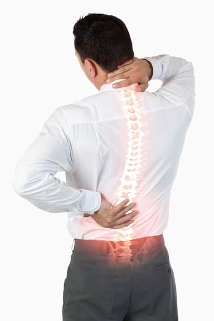 Digital composite of Highlighted spine of man with back pain