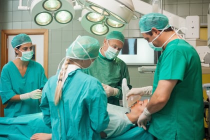 Surgery team working together in a surgical room