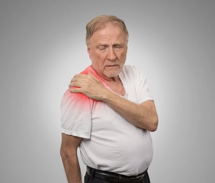 senior man with pain in his shoulder